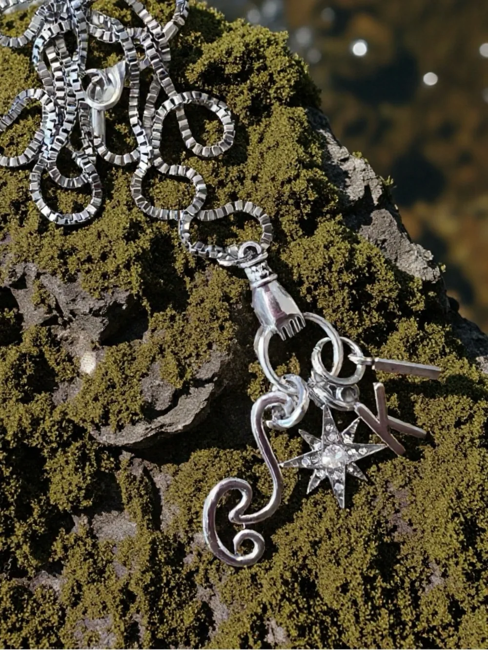 Monk DND necklace with the wind, a star, and KI Dungeons and Dragons jewelry